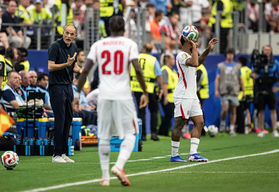 England head coach Thomas Tuchel (L) and Noni Madueke (C)
