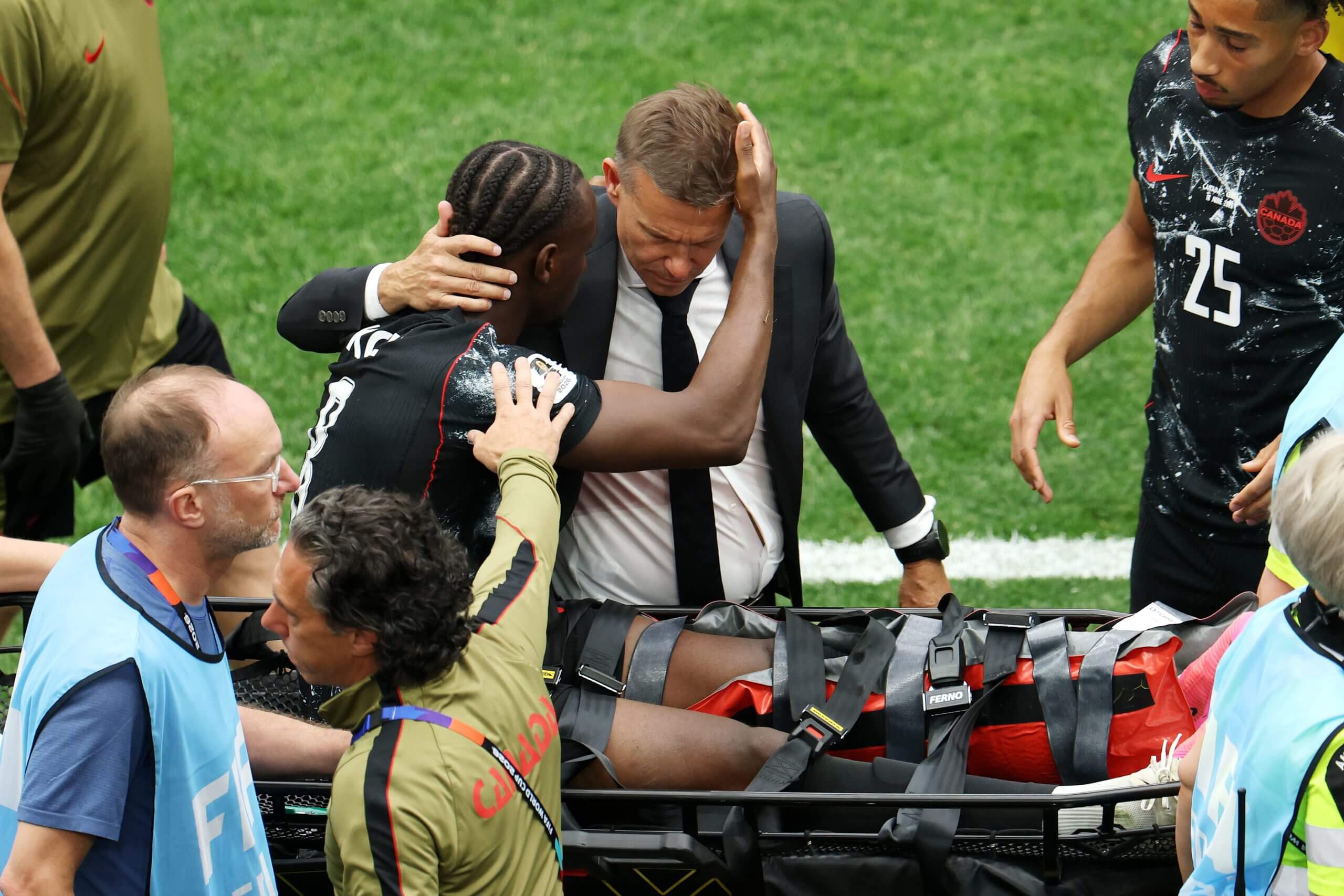 Kone was embraced by Canada head coach Marsch while he went off on a stretcher 