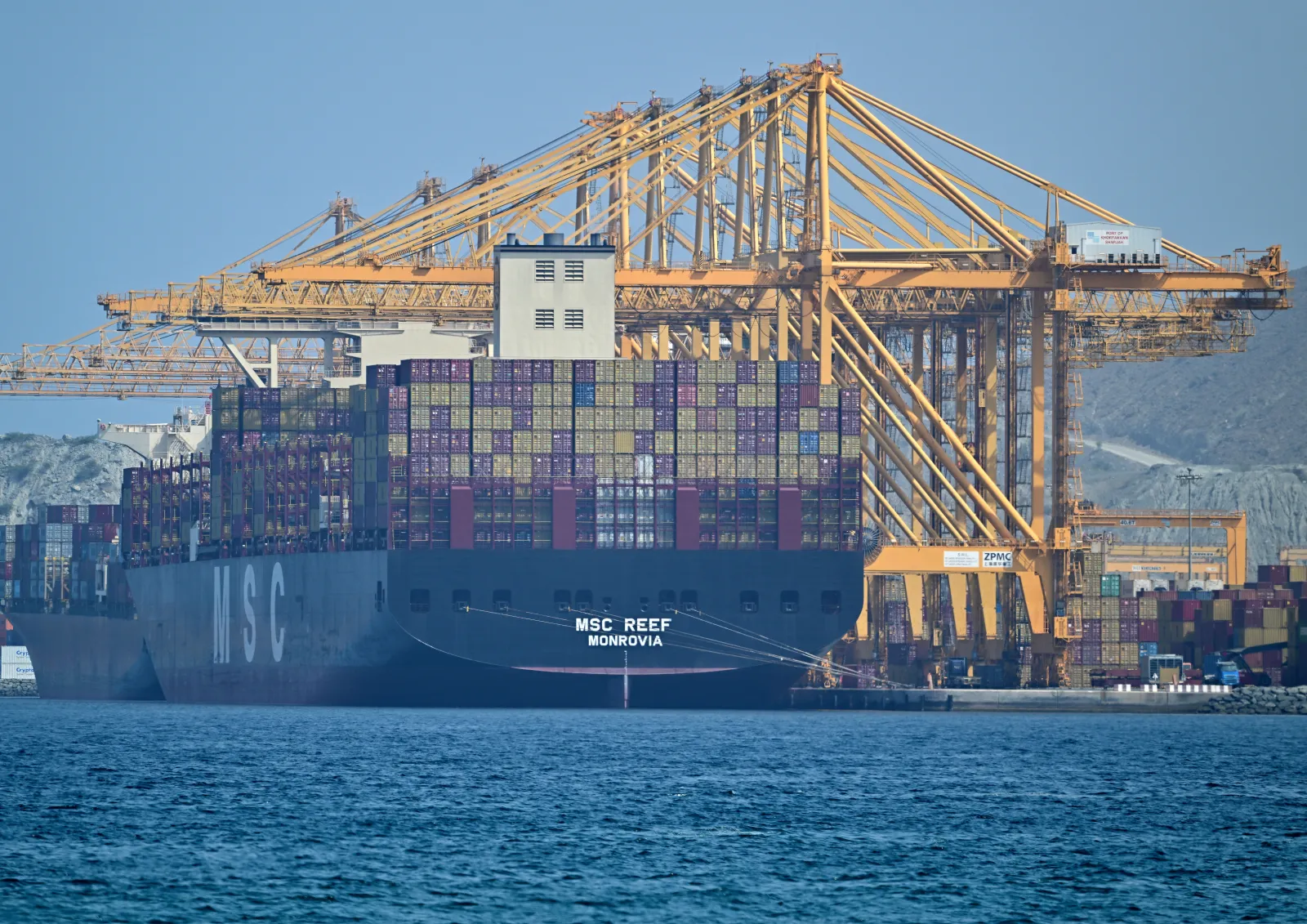 The Liberian flagged container vessel MSC Reef docked along a pier at the Khor Fakkan Container Terminal along the Gulf of Oman on June 28, 2026.