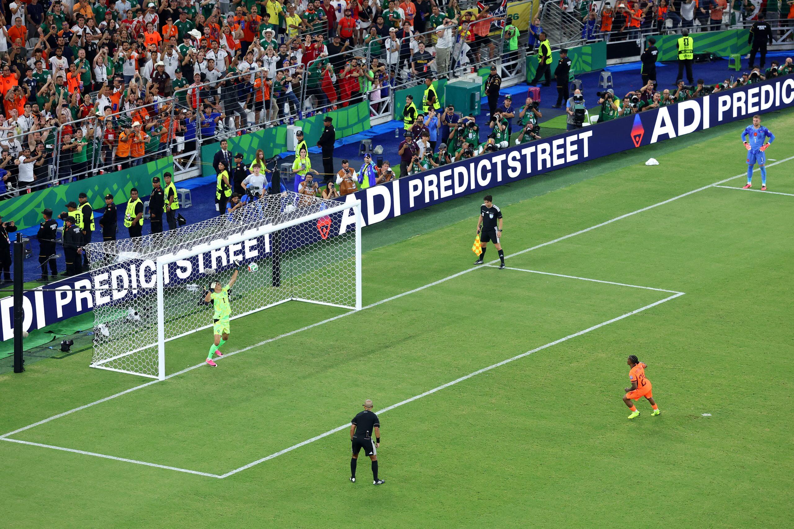 Bounou makes his decisive save, standing up to Summerville's penalty