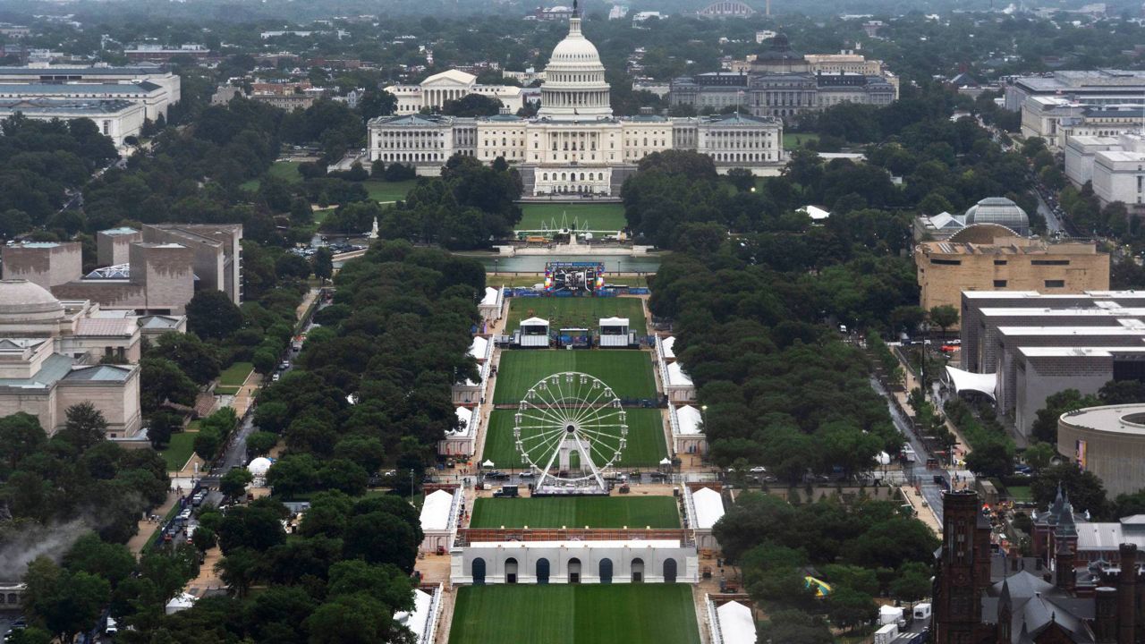 A Ferris wheel is seen on the National Mall for the 250 Anniversary celebration, Tuesday, June 23, 2026, in Washington. (AP Photo/Manuel Balce Ceneta)