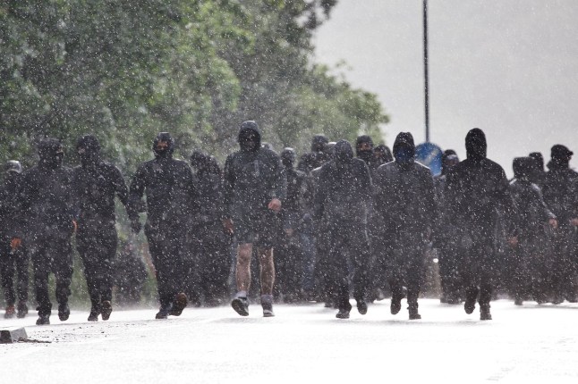 Photo of men marching in Belfast