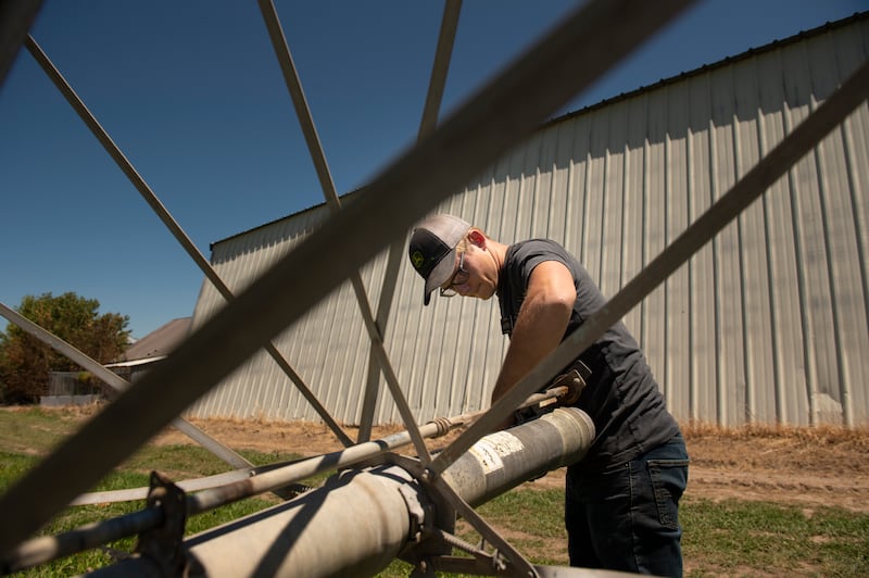 Elder Garrett Mill, a service missionary, works on a wheel line during his shift Saturday, July 18, 2020, at Idaho Falls Crops, a welfare farm of The Church of Jesus Christ of Latter-day Saints, south of Idaho Falls, Idaho.