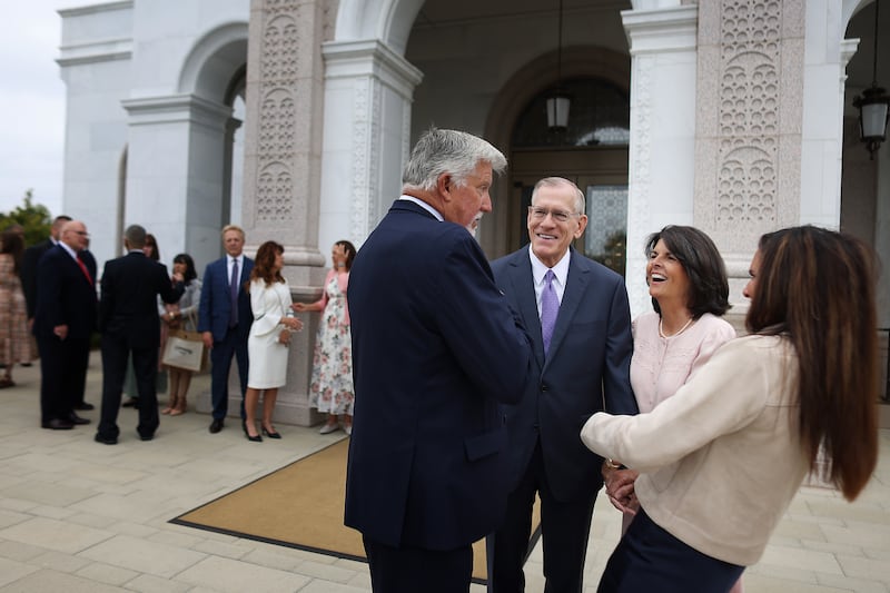 Elder Steven R. Bangerter, executive director of the Temple Department, and his wife, Sister Susan Bangerter, center, talk with attendees at the dedication of the Yorba Linda California Temple on Sunday, June 7, 2026.