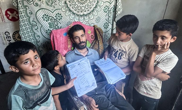 Ismail al-Aqqad and his children in Gaza