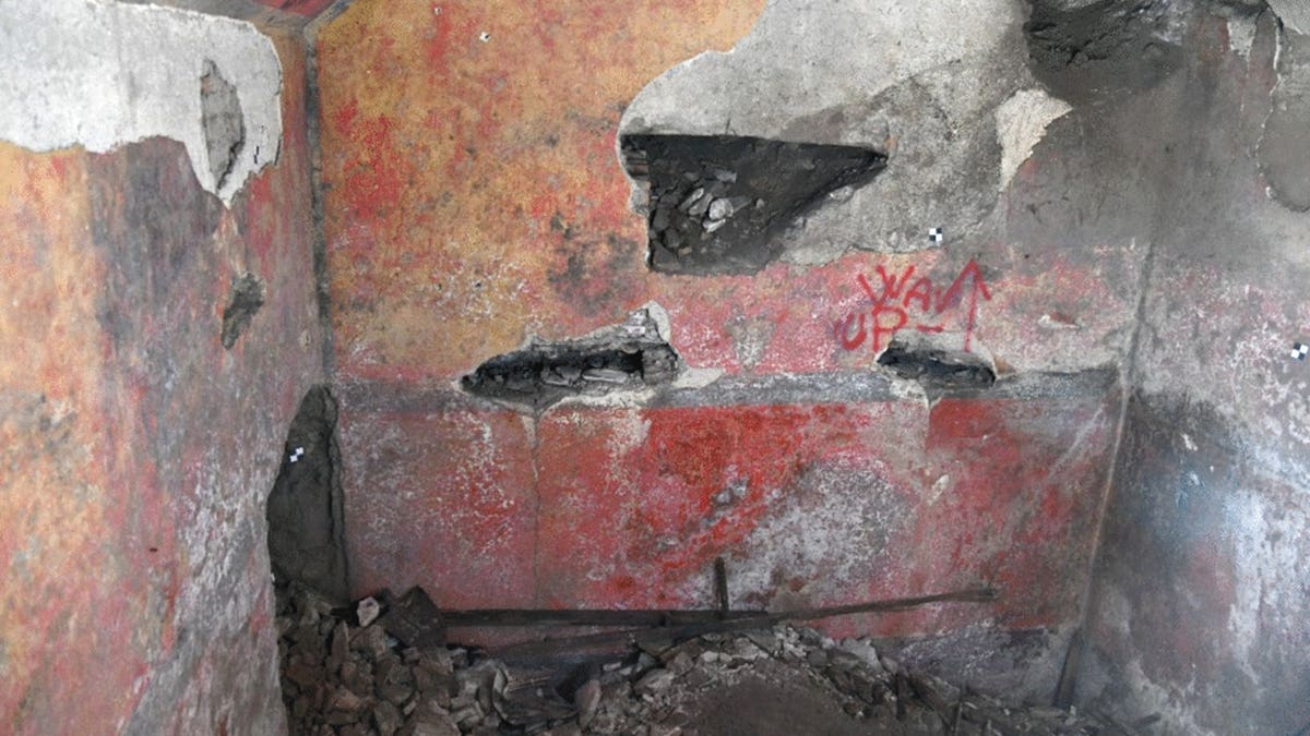 View of degraded frescos in underground domus in Rome