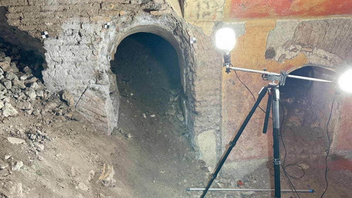 View of equipment inside rubble-filled domus in Rome