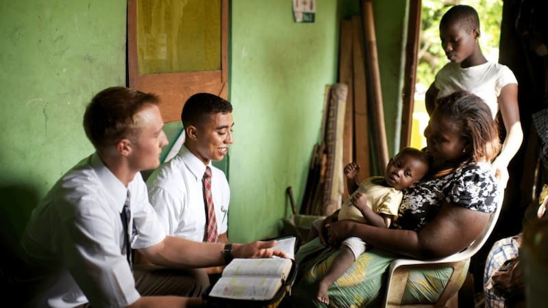 Missionaries of The Church of Jesus Christ of Latter-day Saints teach a family in Ghana in 2026.
