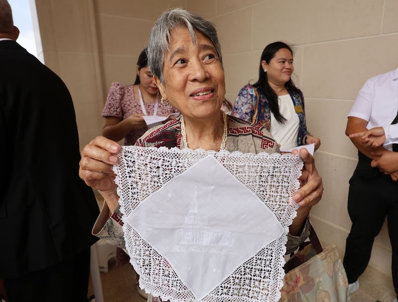Yvonne Villarete holds a handkerchief prior to entering the Bacolod Philippines Temple for the dedication in Bacolod City, Philippines, on Sunday, May 31, 2026.