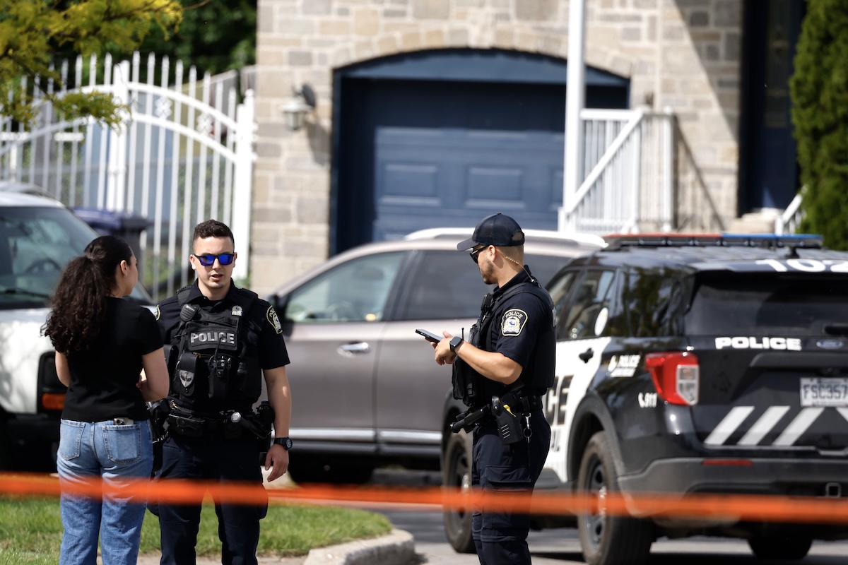 Two Laval police officers and unidentified woman