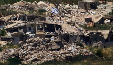An Israeli flag hangs on a destroyed building in southern Lebanon as seen from northern Israel, Thursday June 4, 2026. (AP Photo/Ariel Schalit)