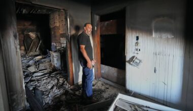 Resident Samih Haidar reacts as he inspects his burned apartment damaged in Israeli strikes in the southern port city of Tyre, Lebanon, Thursday, June 18, 2026. (AP Photo/Hassan Ammar)