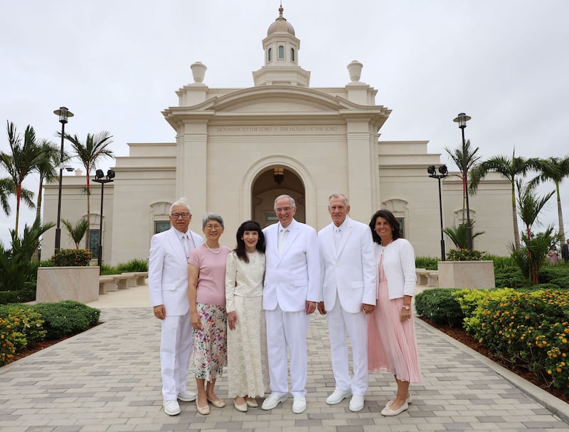 Elder Neil L. Andersen of the Quorum of the Twelve Apostles and his wife, Sister Kathy Andersen, center; Elder Steven R. Bangerter, General Authority Seventy and executive director of the Temple Department, and his wife, Sister Susan Bangerter, right; Elder Chi Hong (Sam) Wong, General Authority Seventy and first counselor in the Philippines Area presidency, and his wife, Sister Carol Wong, pause for a photo outside of the Bacolod Philippines Temple on the day of the dedication in Bacolod City, Philippines, on Sunday, May 31, 2026.