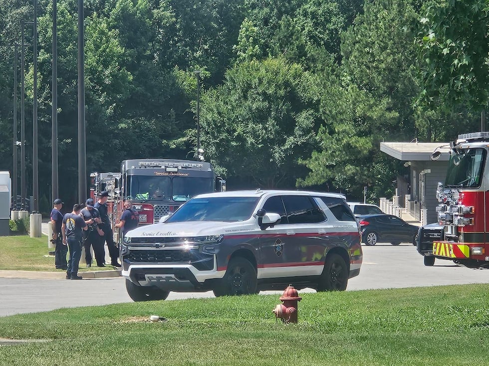 First responders were seen Monday behind a Lowe's Home Improvement as the search for a missing...