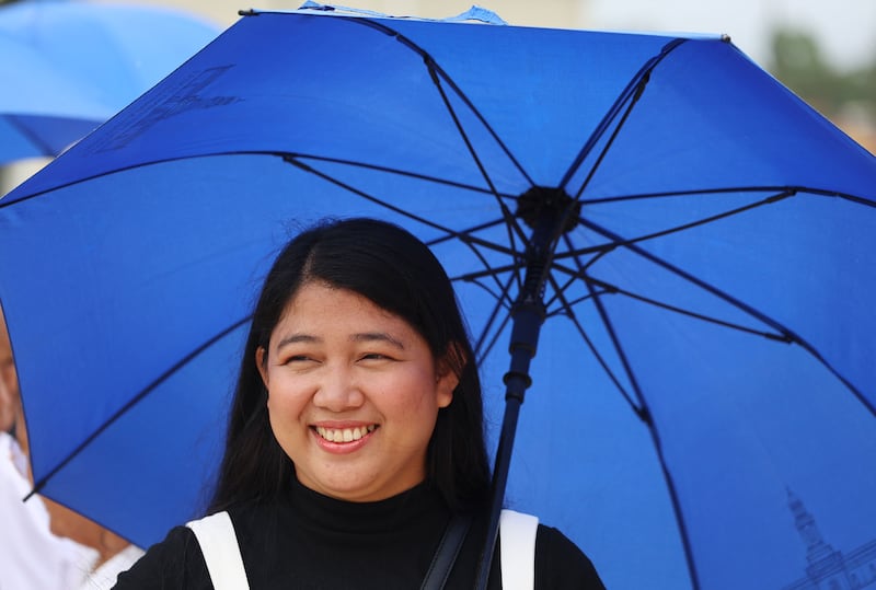 Jerlyn Lozano smiles as she waits outside the Bacolod Philippines Temple for dedication in Bacolod City, Philippines, on Sunday, May 31, 2026.