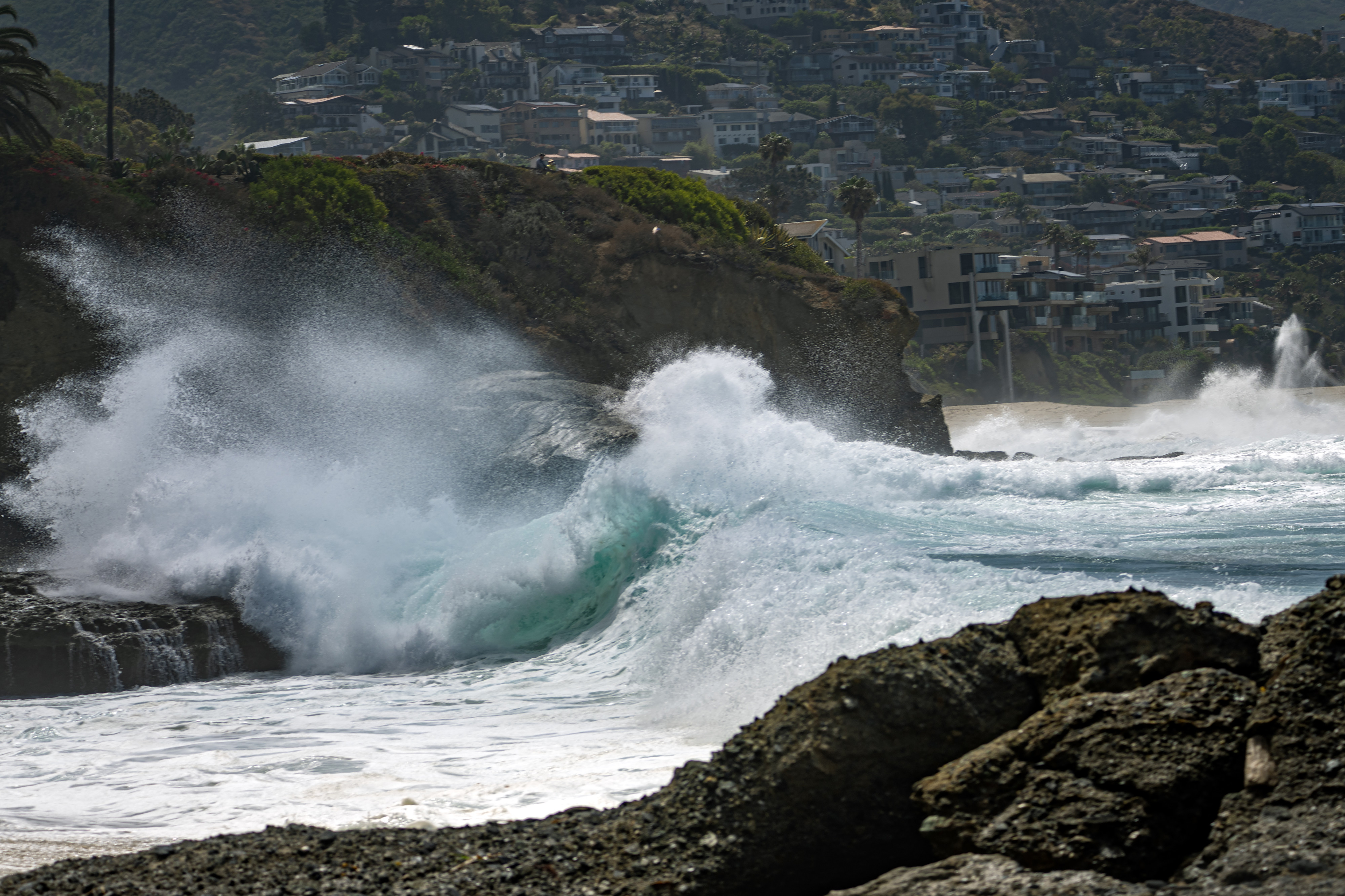 Waves crash on the rocks near Christmas Cove Beach in...