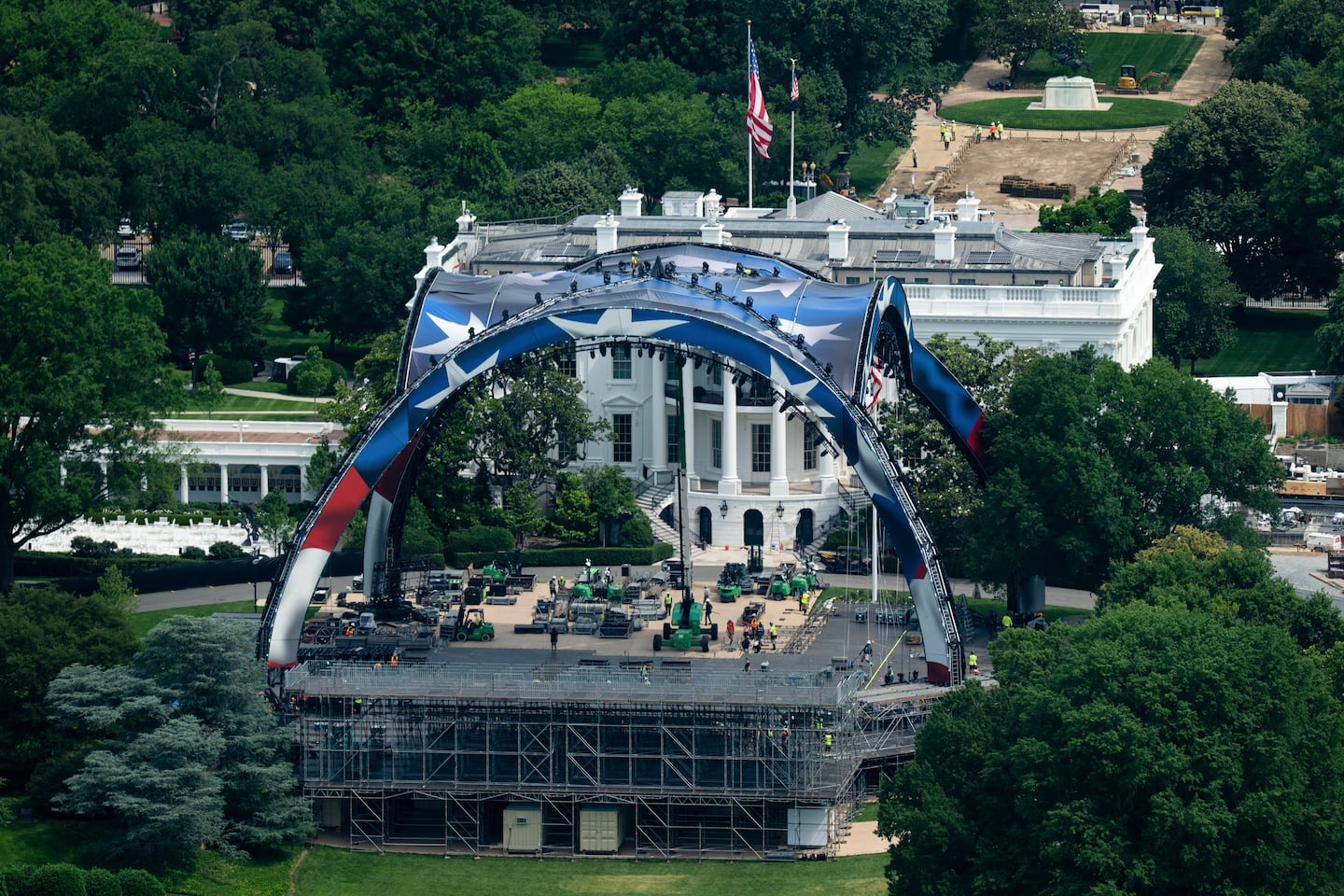 The arch of the Ultimate Fighting Championship arena under construction rises above the South Lawn of the White House in Washington.