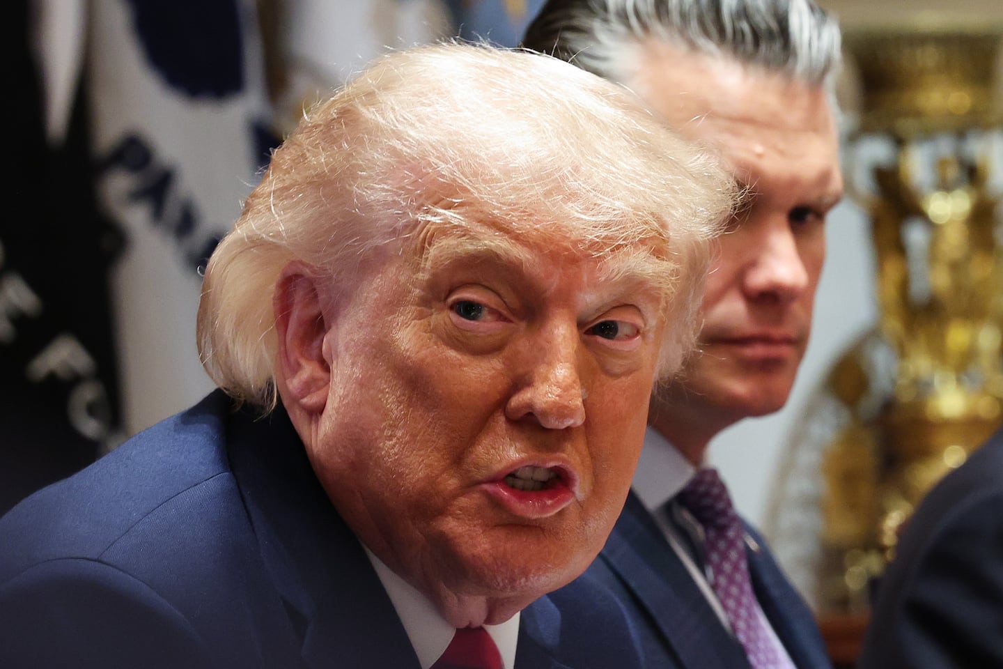 President Trump spoke as Secretary of Defense Pete Hegseth listened during a Cabinet meeting in the White House on May 27.