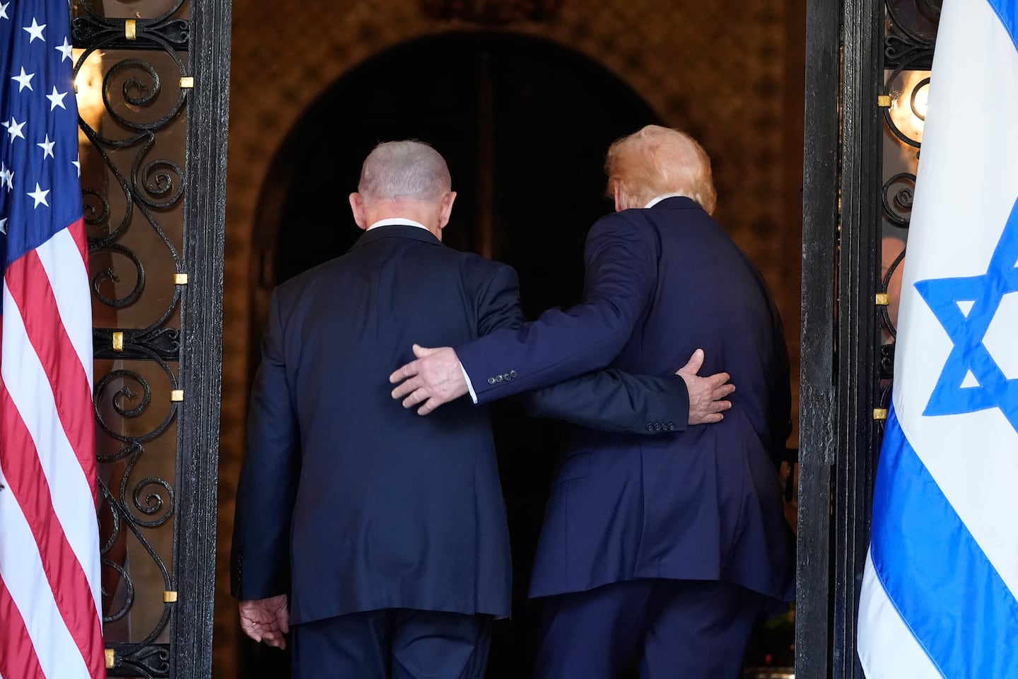 FILE - President Trump and Israel's Prime Minister Benjamin Netanyahu walk into Trump's Mar-a-Lago club, on Dec. 29, 2025, in Palm Beach, Fla., after an arrival greeting.
