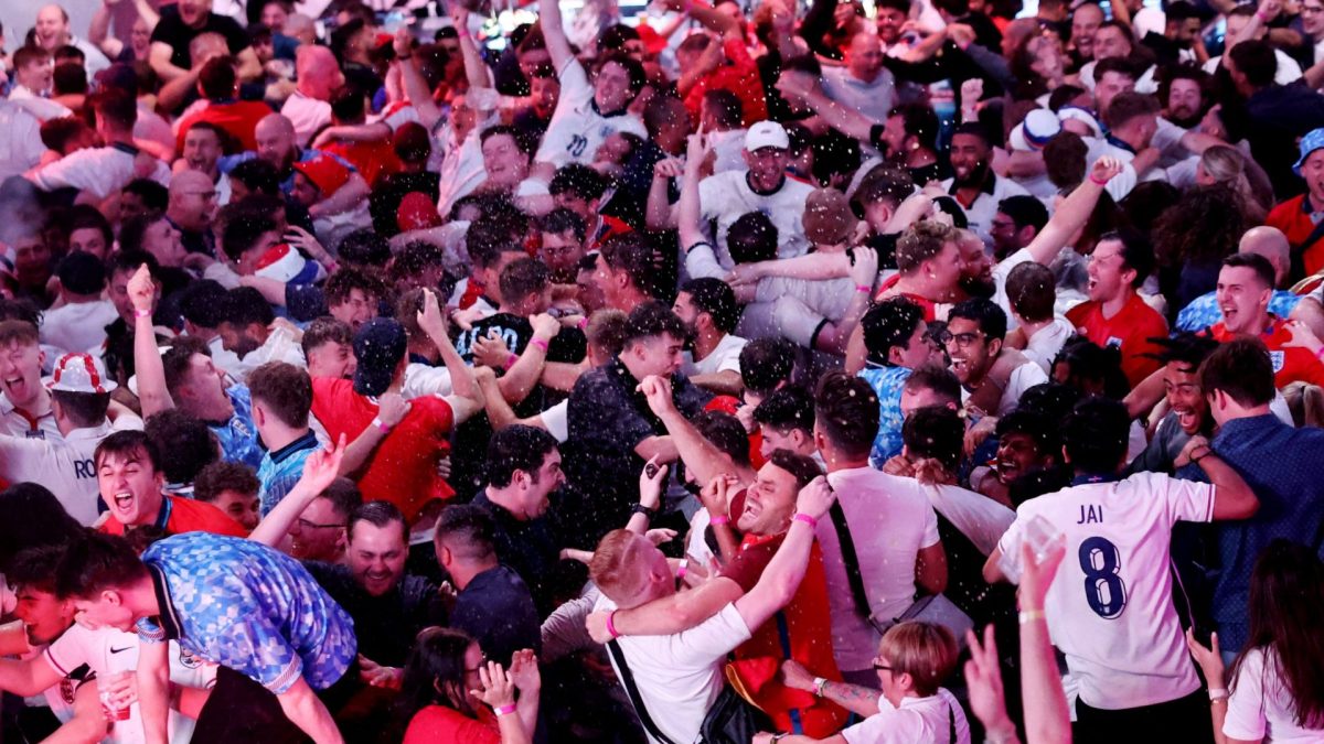 Soccer Football - Euro 2024 - Fans gather for Netherlands v England - BOXPARK Wembley, London, Britain - July 10, 2024 England fans celebrate after Ollie Watkins scores their second goal REUTERS/David Klein