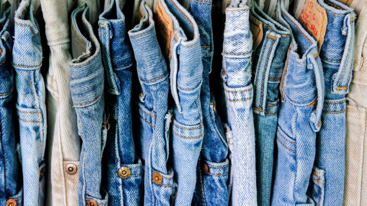 A rack of second hand jeans