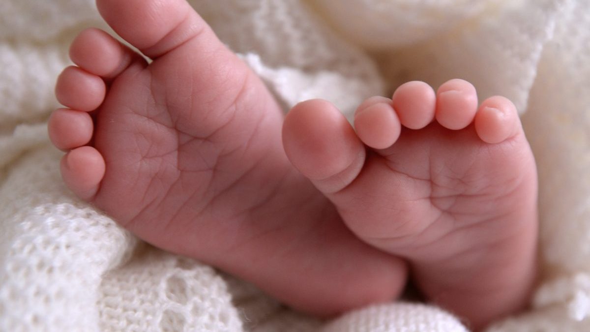 Undated file photo of a new born baby's feet are visible peeking out of a shawl. The fertility rate for England and Wales has fallen for the third year in a row to reach a new record low, figures show. The total fertility rate across both nations, defined as the average number of live children women would expect to have across their childbearing life, stood at 1.41 in 2024. Issue date: Wednesday August 27, 2025. PA Photo. Photo credit should read: Andrew Matthews/PA Wire