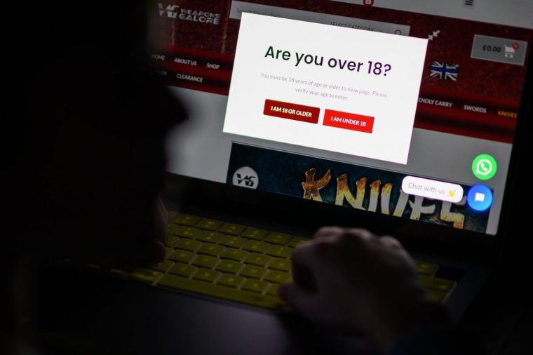 LONDON, ENGLAND - JANUARY 17: In this photo illustration, a teenage child looks at a screen of age-restricted content on a laptop screen on January 17, 2023 in London, England. The Bill aims to protect young and vulnerable viewers by introducing new rules for social media companies which host user-generated content, and for search engines, which will have tailored duties focussed on minimising the presentation of harmful search results. Content that platforms will need to remove includes child sexual abuse material, revenge pornography, selling illegal drugs or weapons, and terrorism. (Photo by Leon Neal/Getty Images)