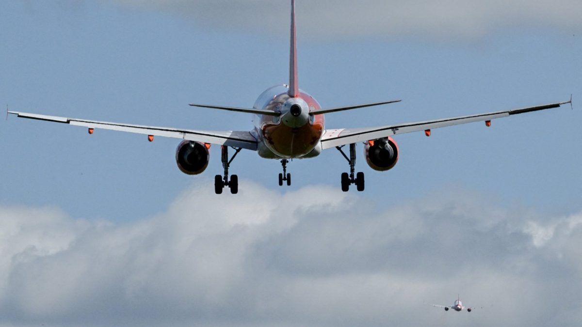 A passanger jet prepares to land at London Gatwick Airport, near Crawley, southern England, on April 20, 2026. British no-frills airline EasyJet on Thursday April 16, said it expects to post a deeper first-half loss compared with one year earlier after the Middle East war sent jet fuel prices soaring. (Photo by Ben STANSALL / AFP via Getty Images)