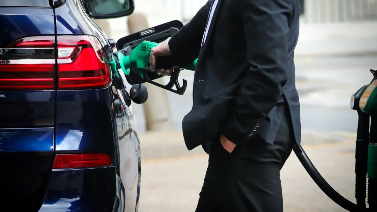 LONDON, ENGLAND - MARCH 9: A person fills their car with fuel at a petrol station in Victoria on March 9, 2026 in London, United Kingdom. Fuel prices remain volatile as peace talks have stalled between the US and Iran in recent weeks. As a result, traffic through the Strait of Hormuz continues to be restricted, impacting the global supply chain of around one fifth of the world's petroleum. In the face of rising costs of fuel, the UK government has eased sanctions on Russian oil and liquefied natural gas (LNG) with a trade license that allows the import of Russian jet fuel and diesel refined in third countries, as well as the shipping of some LNG from Russia. (Photo by Alishia Abodunde/Getty Images)