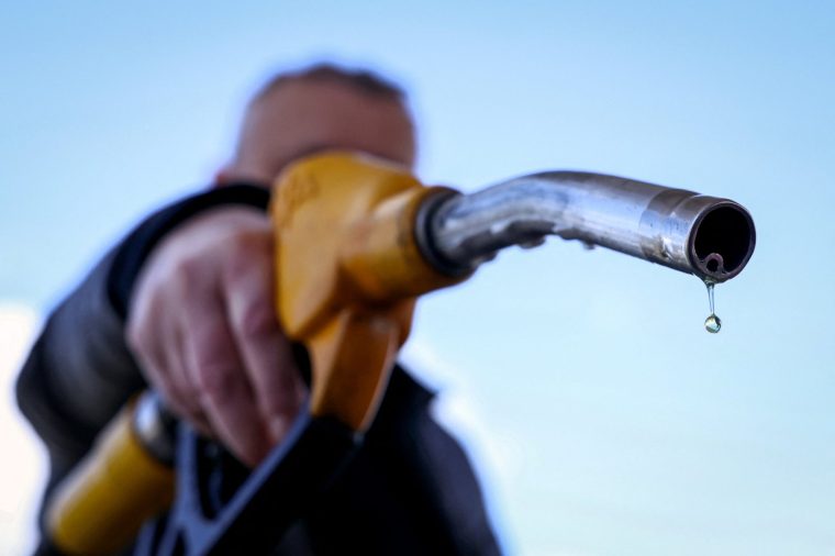 (FILES) A drop of petrol falls from the nozzle of a petrol pump at a petrol station in V??lizy-Villacoublay, near Paris, on March 9, 2026, as Oil prices soared peaking just short of $120 a barrel as the US-Israeli war against Iran continued into a second week, with Tehran launching fresh retaliatory strikes in the Gulf. France's Transport Minister announced on May 21, 2026 during a government press conference on the economic consequences of the war in the Middle East, that fuel subsidies for the road transport sector will be extended for a further three months from June 2026. (Photo by Alain JOCARD / AFP via Getty Images)