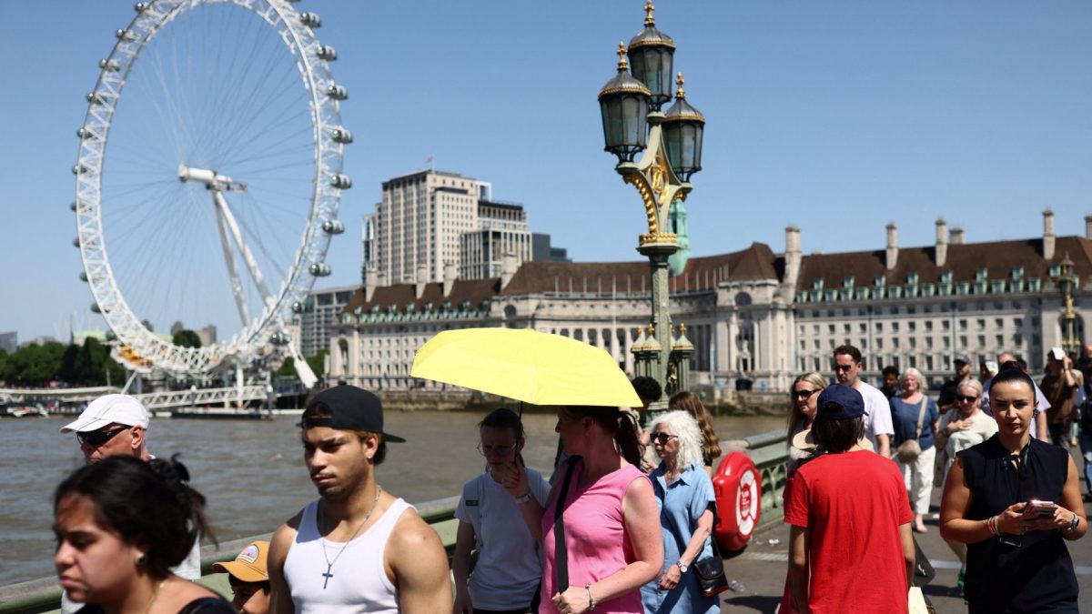 People cross Westminster Bridge during a heatwave, after the UK recorded its hottest May bank holiday ever, in London, Britain, May 26, 2026. REUTERS/Jack Taylor