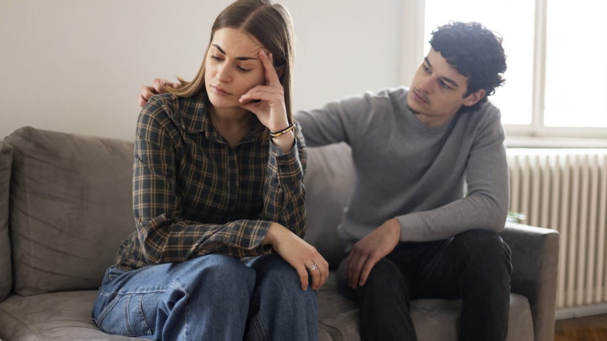 Young couple having relationship difficulties at home. Both about 25 years old, Caucasian people.
