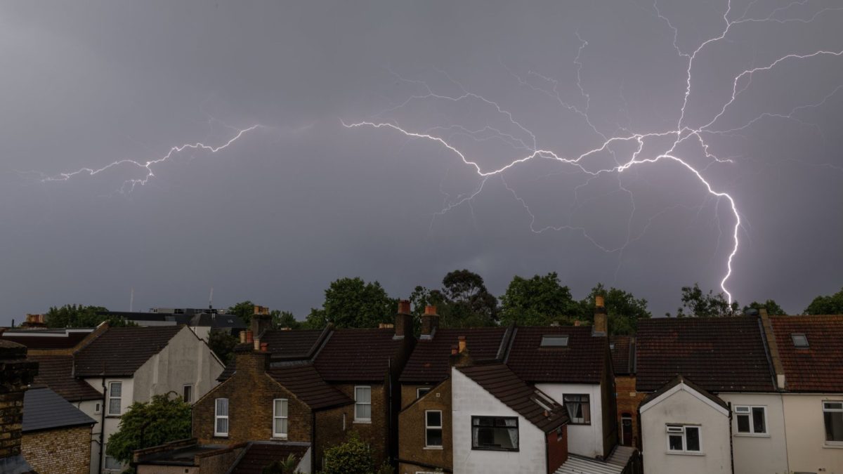 LONDON, ENGLAND - JUNE 02: Lightning flashes are seen above homes on June 02, 2026 in London, England. The Met Office issued a weather warning that heavy rain was thunderstorms were expected to cross the whole country on Monday. (Photo by Dan Kitwood/Getty Images)