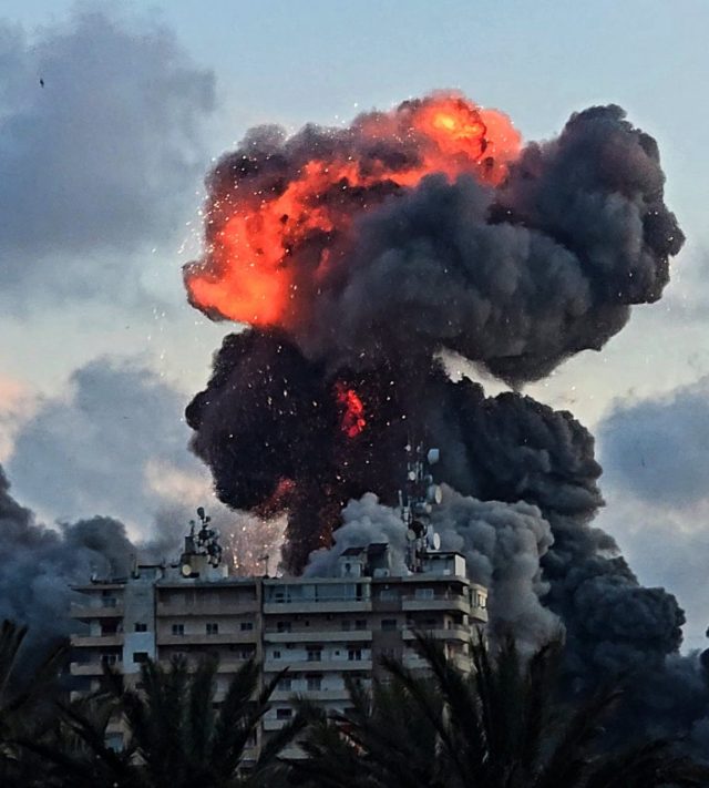 TOPSHOT - A fireball and smoke erupt from a building following an Israeli strike in Tyre, southern Lebanon, on May 28, 2026. The Israeli military said on May 28 it had begun new strikes on Hezbollah infrastructure around the southern Lebanese city of Tyre after issuing an evacuation warning to its residents. (Photo by KAWANT HAJU / AFP via Getty Images)