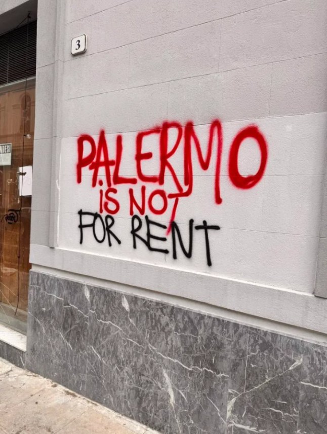 Pic Shows graffitti in Palermo for rent near to Piazza Groce deli Vesper which is closed for Dua Lipa and her husband Callum Turner wedding bash