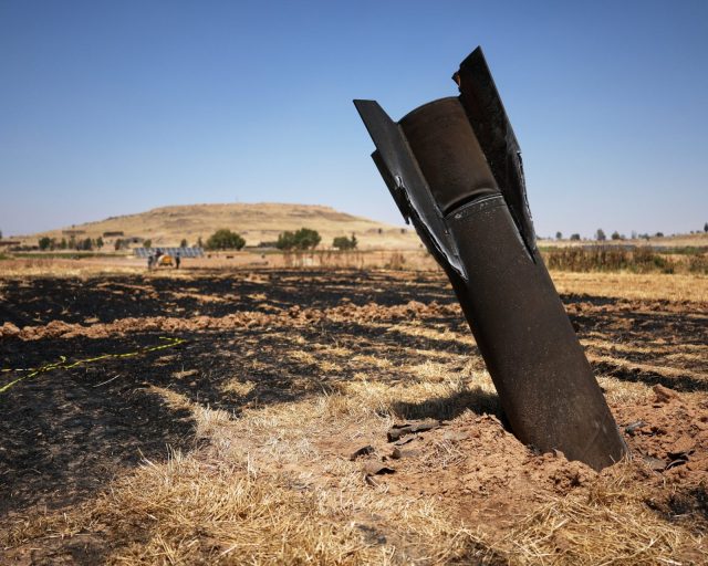 A projectile is seen in a burned agricultural field near the town of Najha, Syria, Monday, June 8, 2026, after debris from Iranian missile launches during the Iran-Israel conflict fell in the area.(AP Photo/Ghaith Alsayed)