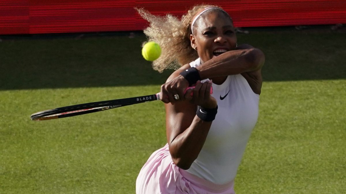 Serena Williams of the United States, hits a return as she and playing partner Victoria Mboko of Canada play against Nicole Melichar-Martinez of Canada and Erin Routliffe of New Zealand during their first round doubles match at the Queen's Club tennis championships in London, Tuesday, June 9, 2026. (AP Photo/Alberto Pezzali)