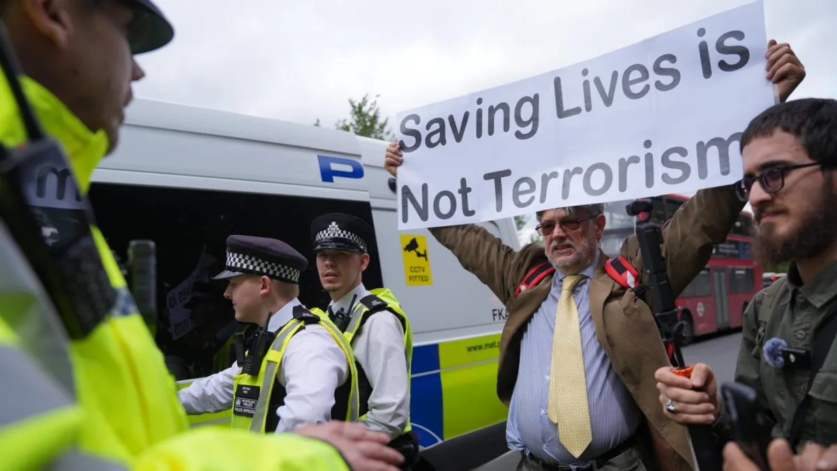 Protesters are spoken to by police outside Woolwich Crown Court, London, during a hearing where Palestine Action activists are due to be sentenced over over a break-in at the UK base of an Israel-based defence firm, Elbit Systems site near Bristol on August 6 2024. Charlotte Head, Samuel Corner, Leona Kamio and Fatema Rajwani were convicted of criminal damage, while Corner was found guilty of causing grievous bodily harm when he fractured a police officer's spine during the raid. Picture date: Friday June 12, 2026. PA Photo. Photo credit should read: Yui Mok/PA Wire