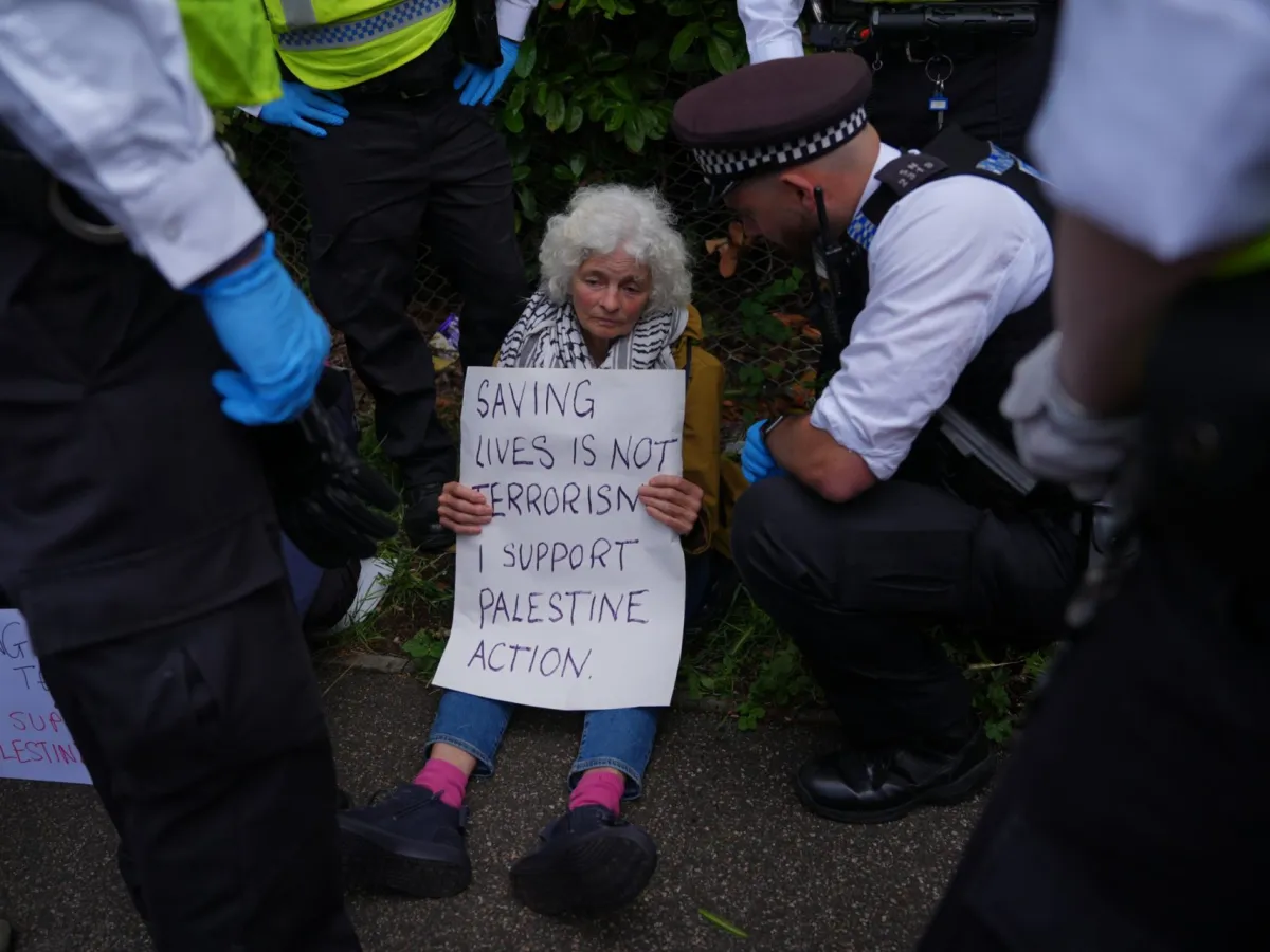 Protesters are detained by police outside Woolwich Crown Court, London, during a hearing where Palestine Action activists are due to be sentenced over over a break-in at the UK base of an Israel-based defence firm, Elbit Systems site near Bristol on August 6 2024. Charlotte Head, Samuel Corner, Leona Kamio and Fatema Rajwani were convicted of criminal damage, while Corner was found guilty of causing grievous bodily harm when he fractured a police officer's spine during the raid. Picture date: Friday June 12, 2026. PA Photo. Photo credit should read: Yui Mok/PA Wire