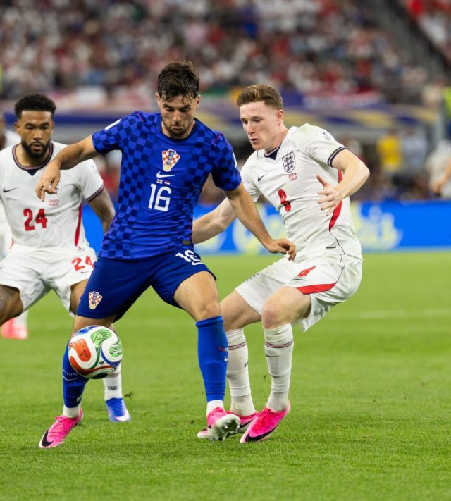 DALLAS, TEXAS - JUNE 17: Elliot Anderson and Reece James of England close in on Martin Baturina of Croatia during the FIFA World Cup 2026 Group L match between England and Croatia at Dallas Stadium on June 17, 2026 in Dallas, United States. (Photo by Simon M Bruty/Getty Images)