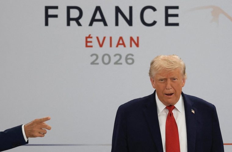TOPSHOT - US President Donald Trump arrives to attend a morning work meeting to "revive balanced, inclusive, and sustainable economic growth for the benefit of all" in the presence of the G7 countries, partner countries, the International Monetary Fund, and the OECD, as part of the G7 summit, in Evian, eastern France, on June 17, 2026. G7 leaders will discuss on June 17, 2026, the security risks posed by AI and social media on the last day of a summit dominated by US the President, before host French President dines with his US counterpart at the Palace of Versailles. The three-day summit of the leaders of Canada, France, Germany, Italy, Japan,B ritain and the United States has focused intensely on the US' deal to end the war with Iran and efforts to pressure Russia into brokering peace with Ukraine. (Photo by Ludovic MARIN / AFP via Getty Images)