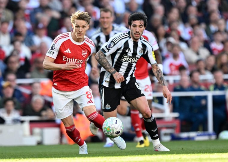 LONDON, ENGLAND - APRIL 25: Martin Odegaard of Arsenal is challenged by Sandro Tonali of Newcastle United during the Premier League match between Arsenal and Newcastle United at Emirates Stadium on April 25, 2026 in London, England. (Photo by David Price/Arsenal FC via Getty Images)