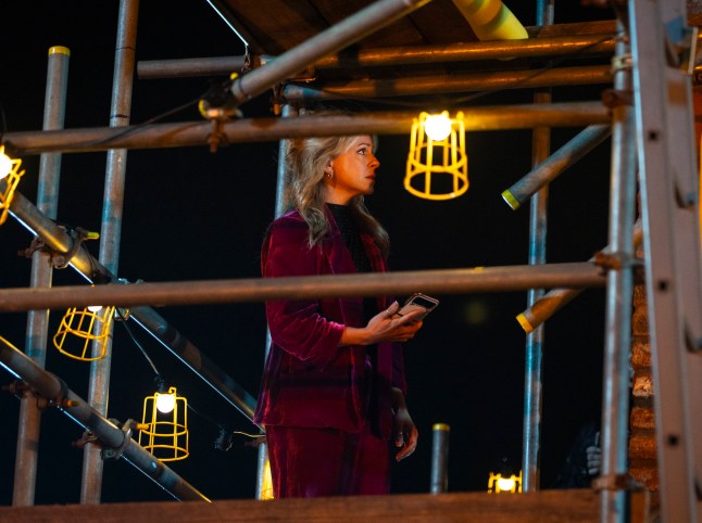 Sarah Platt stood atop some scaffolding in Coronation Street