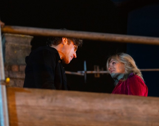 Theo Silverton and Sarah Platt atop some scaffolding in Coronation Street