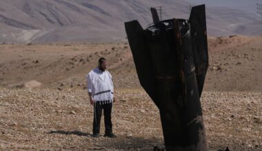 A man look at the wreckage of an Iranian missile that landed near the West Bank city of Jericho Monday, June 8, 2026. (AP Photo/Mahmoud Illean)