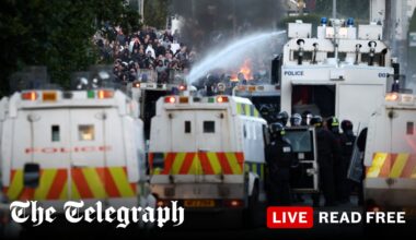 Belfast attack live: Rioters clash with police near migrant hotel