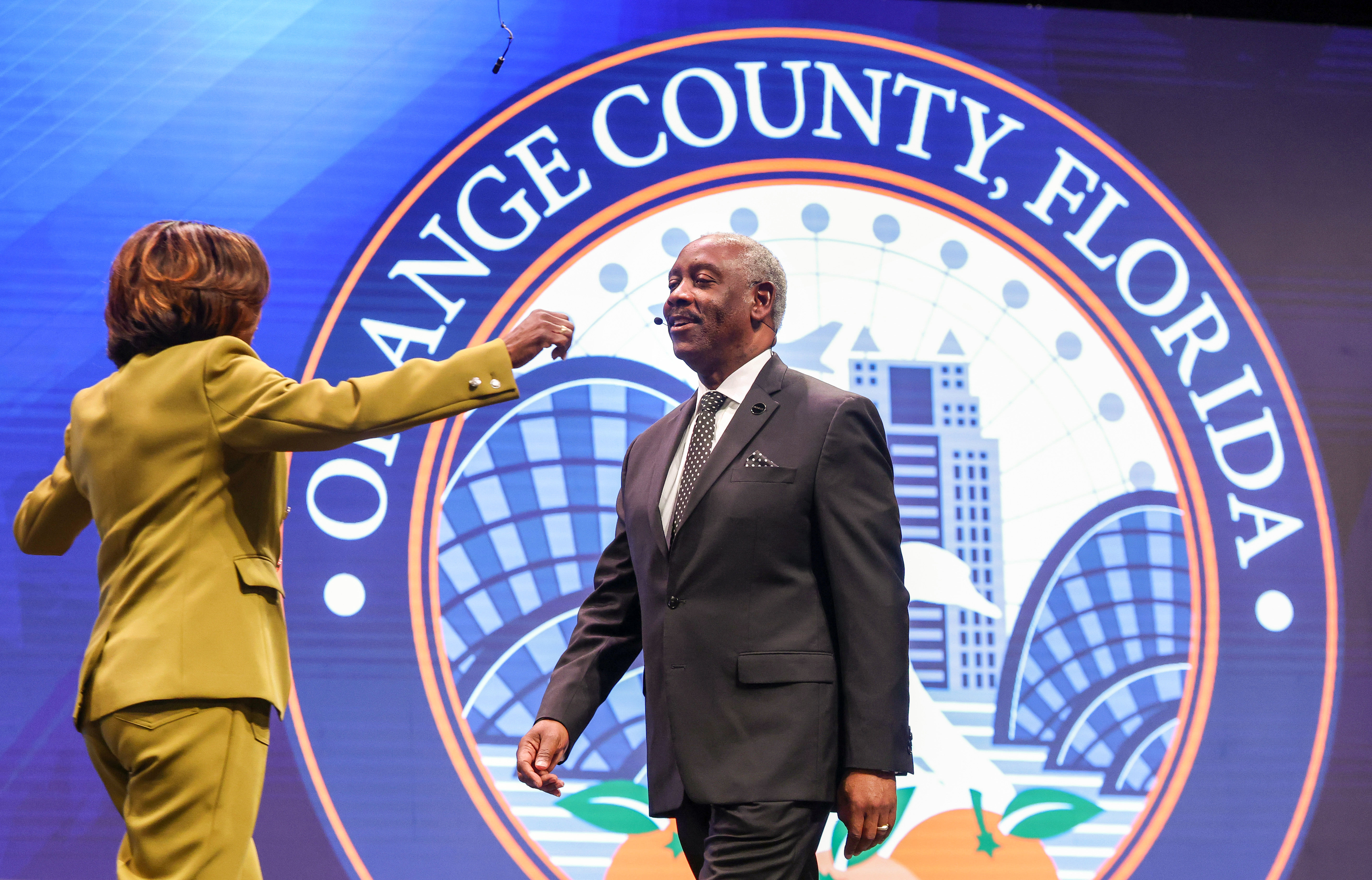 Orange County Mayor Jerry Demings gets a hug from Val...