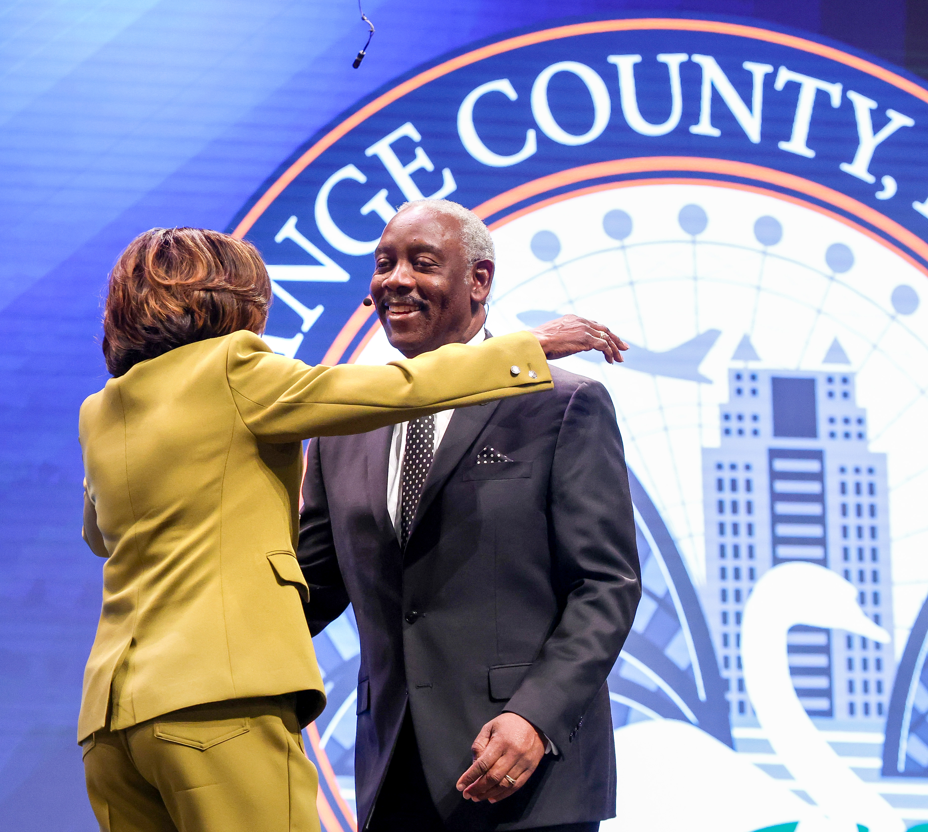 Orange County Mayor Jerry Demings gets a hug from Val...