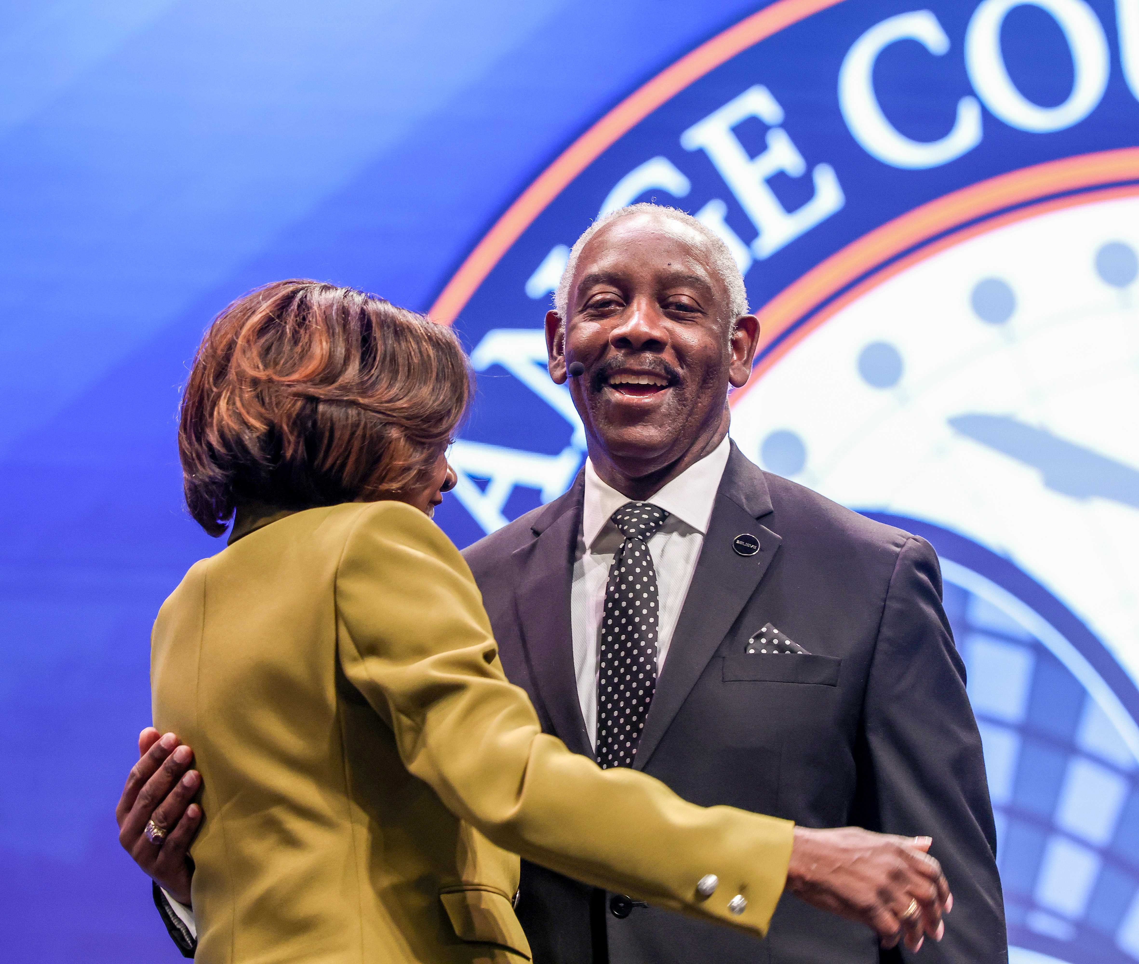 Orange County Mayor Jerry Demings gets a hug from Val...