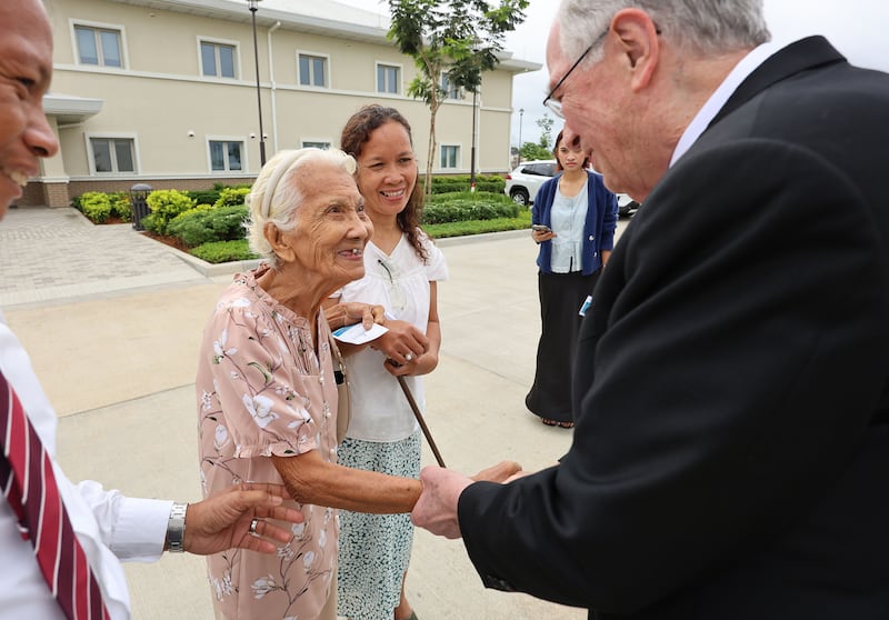 Elder Neil L. Andersen of the Quorum of the Twelve Apostles greets 92-year-old Elsa Illorin before the Bacolod Philippines Temple dedication in Bacolod City, Philippines, on Sunday, May 31, 2026.